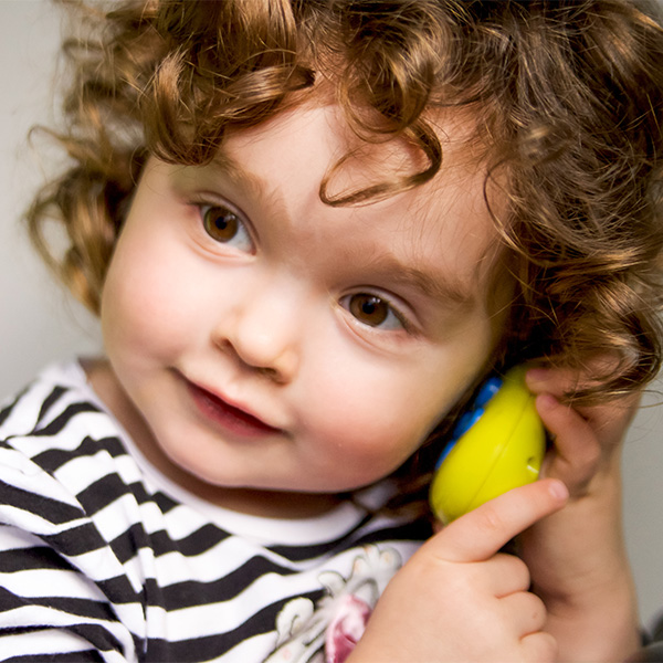 Little girl on play phone