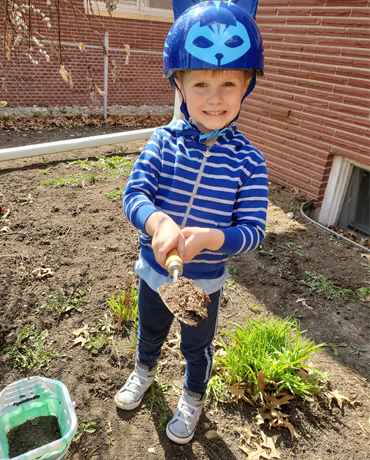 kid in his garden