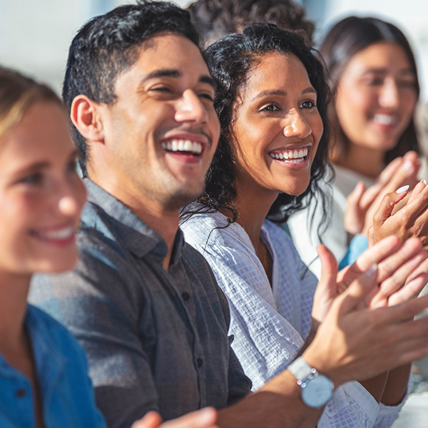 Group of Adults Clapping and Smiling