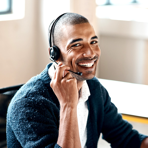Man with headset on smiling