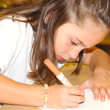 girl writing in a workbook